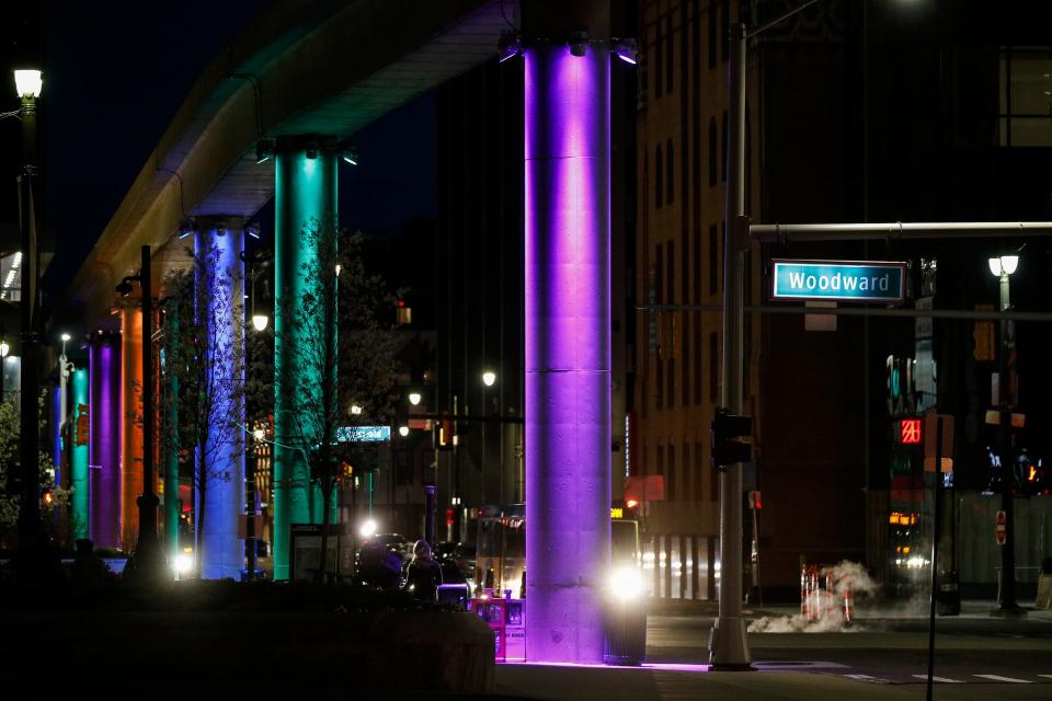 New LED lights on the People Mover support columns help to illuminate Detroit after dark long after the draft leaves.