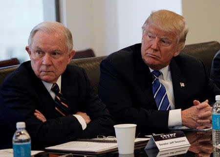 Donald Trump sits with U.S. Senator Jeff Sessions (R-AL) at Trump Tower in Manhattan, New York, U.S., October 7, 2016. REUTERS/Mike Segar/File Photo