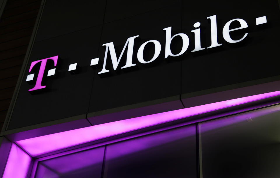 A sign for a T-Mobile store is displayed, Wednesday, Nov. 9, 2011, in New York. T-Mobile is a subsidiary of Deutsche Telekom.  New plans at T-Mobile USA helped the struggling No. 4 carrier stabilize its business in the third quarter after dismal results earlier this year. (AP Photo/Mark Lennihan)