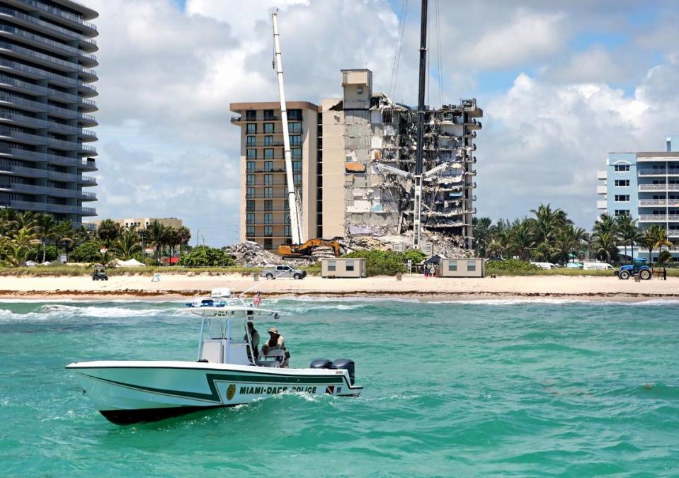 The Miami-Dade Marine Patrol Unit navigates as search and rescue personnel search for survivors through the rubble at the Champlain Towers South Condo in Surfside, Florida, Sunday, June 27, 2021. The apartment building partially collapsed on Thursday, June 24.