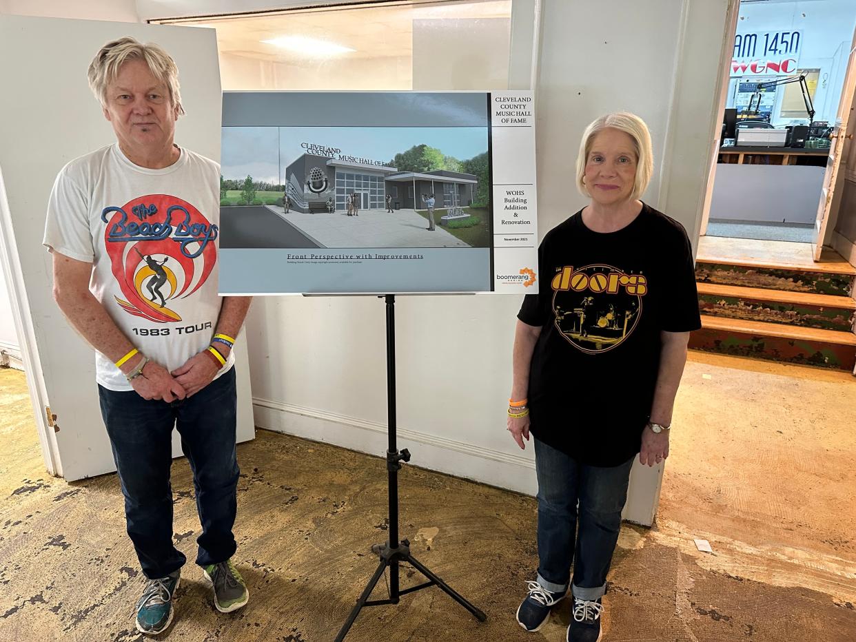 Phil and Patti Weathers show off a conceptual drawing of the future home of the Cleveland County Music Hall of Fame, which will be located in the former WOHS radio station.
