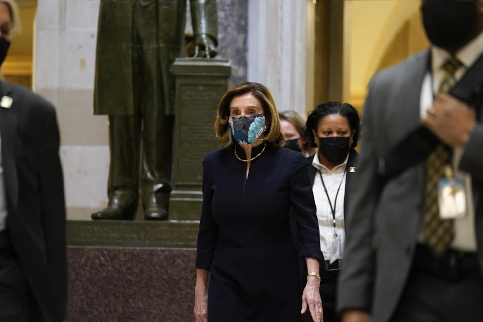 Speaker of the House Nancy Pelosi of Calif., walks through Statuary Hall on Capitol Hill in Washington, Wednesday, Jan. 13, 2021. (AP Photo/Susan Walsh)