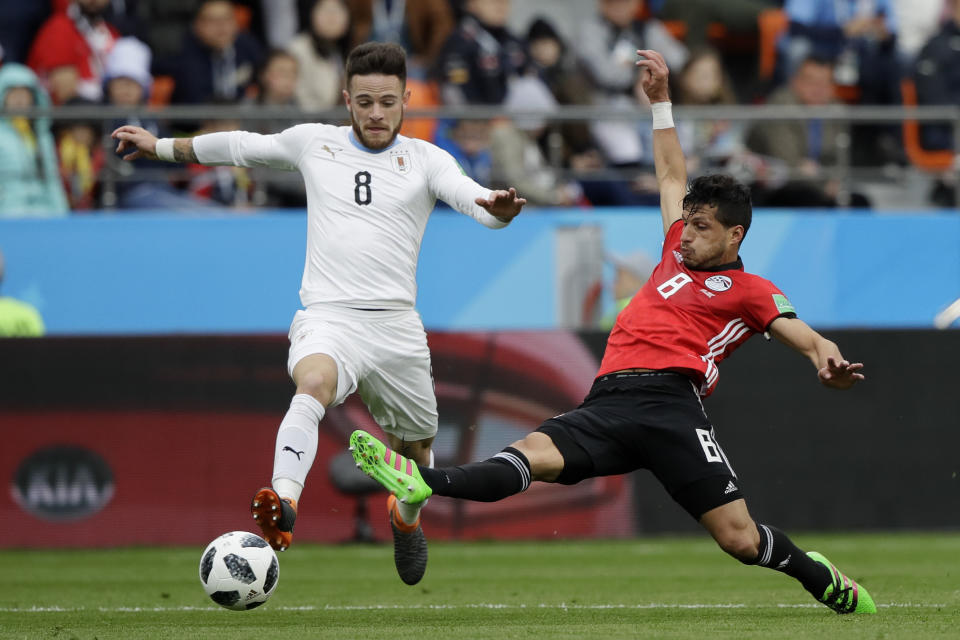 <p>Uruguay’s Nahitan Nandez, left, and Egypt’s Tarek Hamed battle for possession during the Group A fixture in Ekaterinburg (AP) </p>