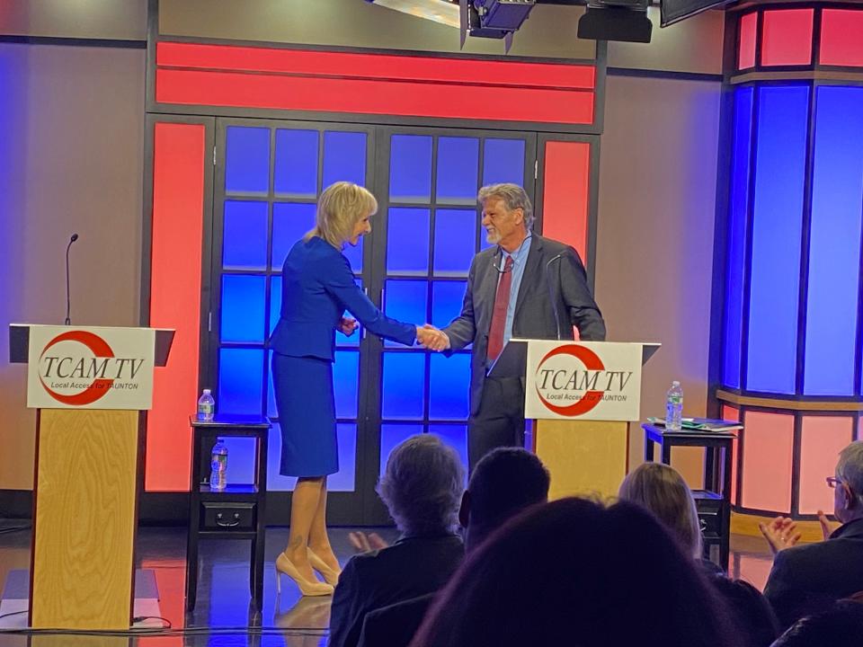 Taunton Mayor Shaunna O'Connell and opponent Ed Correira shake hands after their intense debate at the candidates night forum, hosted by TCAM on Thursday, Oct. 26, 2023.