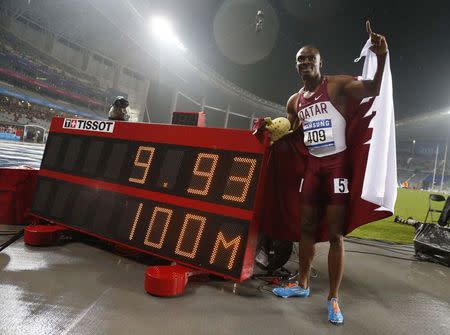 Qatar's Femi Seun Ogunode celebrates his win in the men's 100m final with an Asian record of 9.93 seconds on a wet track at the Incheon Asiad Main Stadium during the 17th Asian Games September 28, 2014. REUTERS/Jason Reed