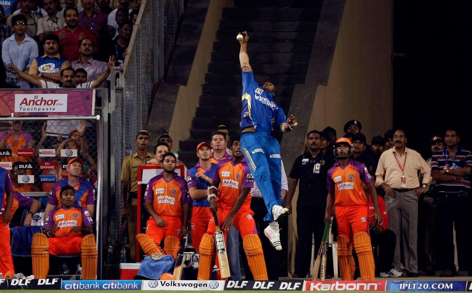 Kieron Pollard of Mumbai Indians jumps to catch the ball in spectacular fashion