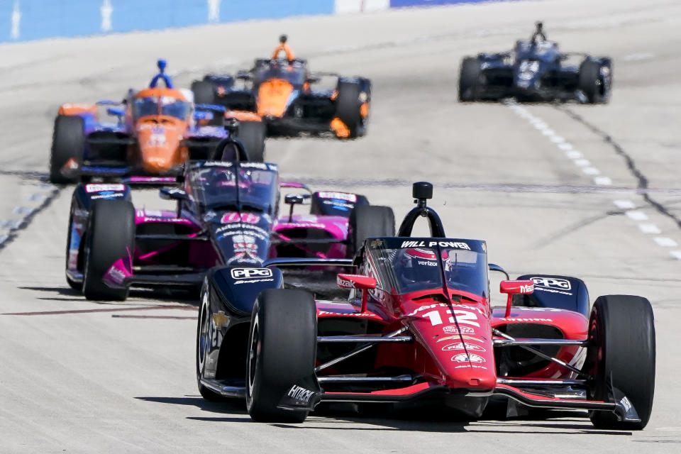 Will Power (12) attempts to stay in front of other drivers during the NTT IndyCar Series XPEL 375 at Texas Motor Speedway in Fort Worth, Texas, on Sunday, March 20, 2022. (AP Photo/Larry Papke)