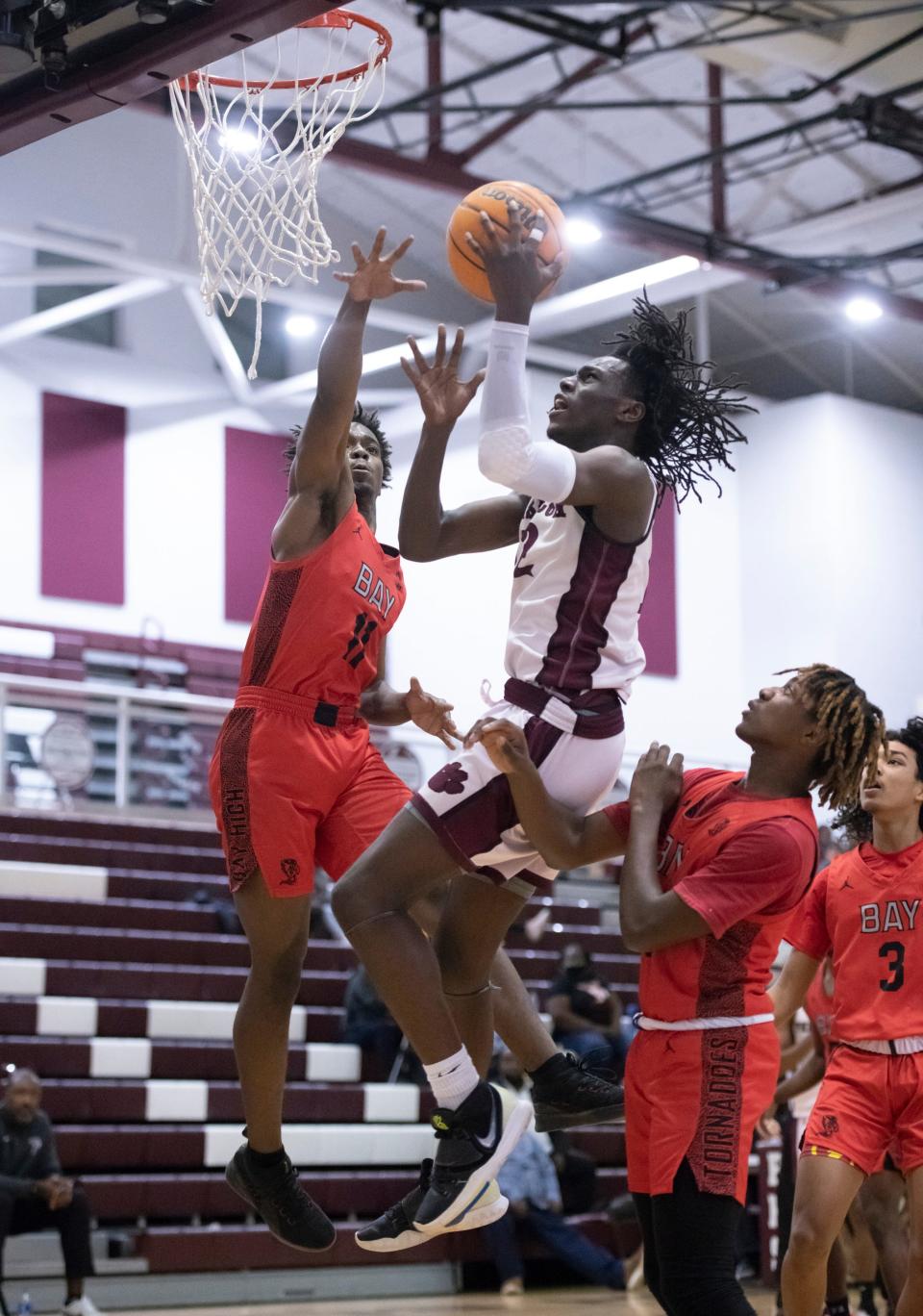 James Robinson (12) shoots during the Bay H.S. vs Pensacola H.S. boys basketball game at Pensacola High School in Pensacola on Wednesday, Jan. 12, 2022.