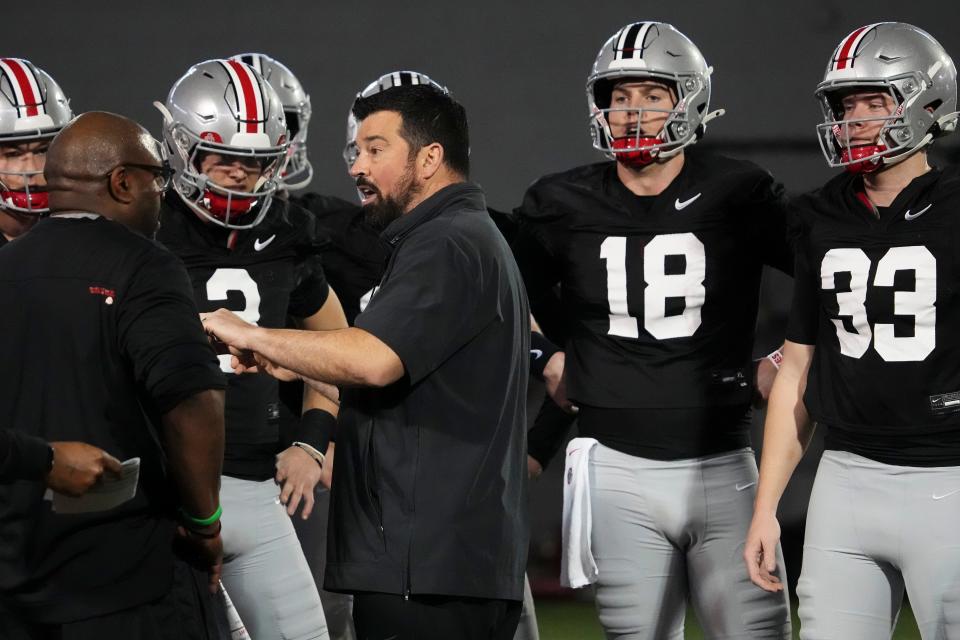 Mar 7, 2024; Columbus, OH, USA; Ohio State Buckeyes head coach Ryan Day talks to quarterbacks during spring football practice at the Woody Hayes Athletic Center.
