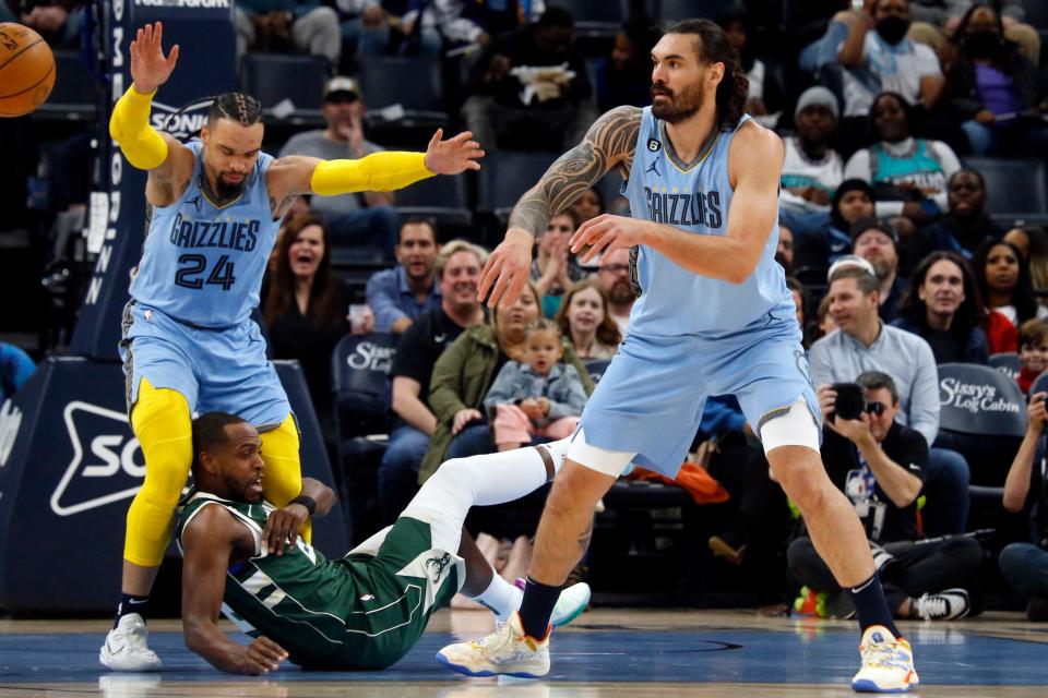 Bucks forward Khris Middleton grabs the leg of Grizzlies forward Dillon Brooks and eventually trips him after having the ball stolen by Memphis center Steven Adams during the first half at FedExForum. Middleton was charged with a flagrant one foul  on the play.