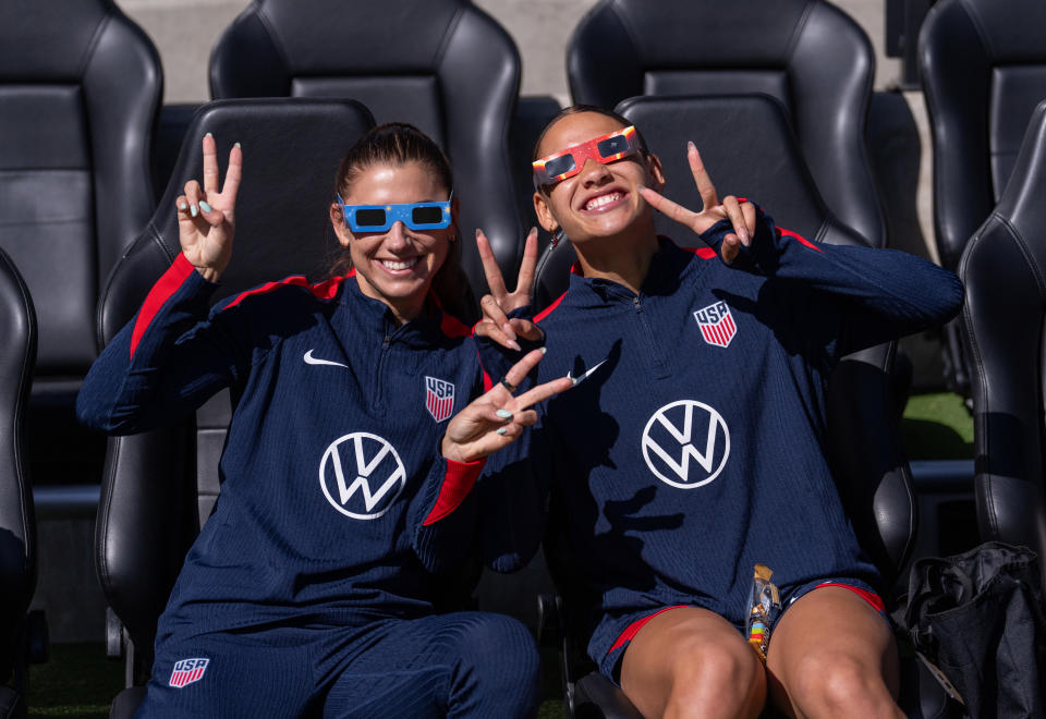 COLUMBUS, OH - APRIL 8: Alex Morgan and Trinity Rodman of the United States pose while wearing eclipse sunglasses before USWNT training at Lower.com Field on April 8, 2024 in Columbus, Ohio. (Photo by Brad Smith/ISI Photos/USSF/Getty Images for USSF)