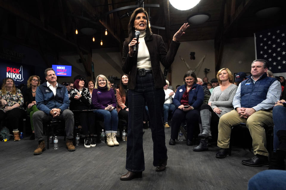 Republican presidential candidate Nikki Haley speaks at a town hall campaign event after receiving an endorsement from New Hampshire Gov. Chris Sununu, seated in the front row at left, Tuesday, Dec. 12, 2023, in Manchester, N.H. (AP Photo/Robert F. Bukaty)