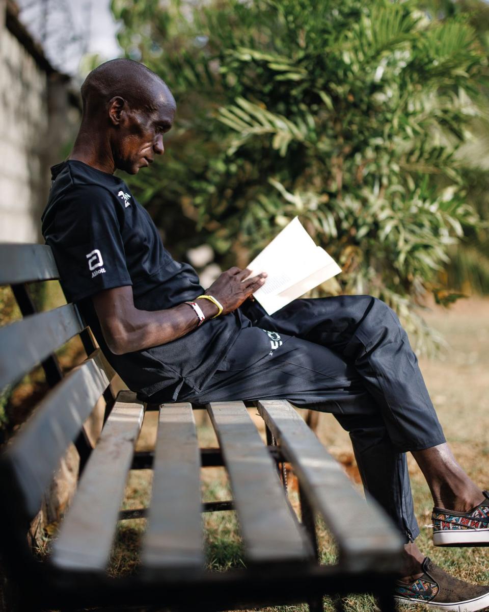eliud kipchoge takes a quiet moment at home in elodoret, kenya, to read a book
