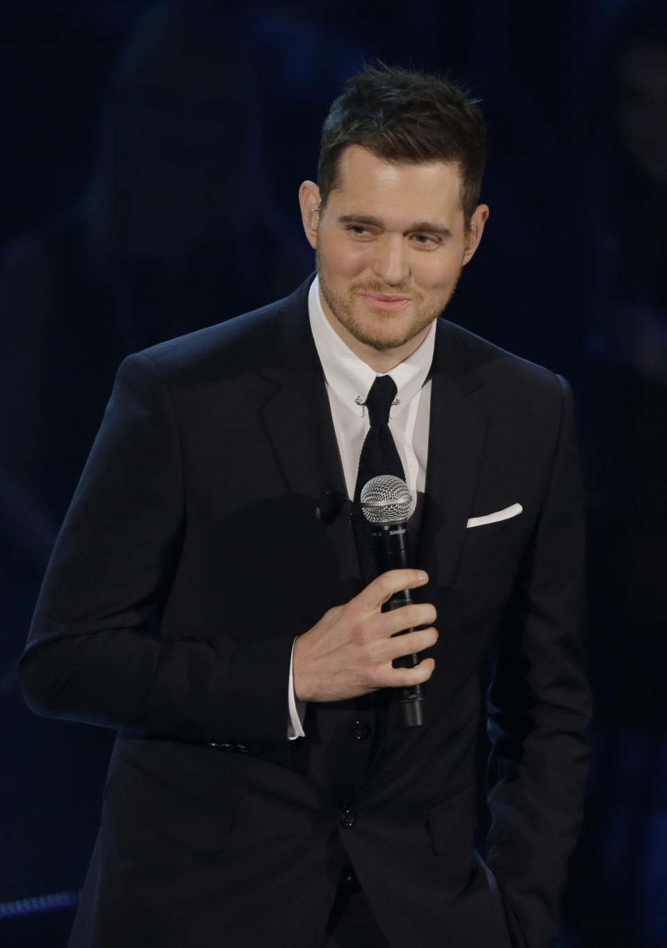 FILE - In this Nov. 26, 2012 file photo, Canadian singer Michael Buble' performs during the Italian State RAI TV program "Che Tempo che Fa", in Milan, Italy. Most of Buble’s albums have reached multiplatinum status and his last three releases have hit No. 1 on the Billboard 200 albums chart, including 2011’s triple platinum “Christmas.” His new album, “To Be Loved,” will be released April 23 and includes a tribute to his wife, Argentine TV actress Luisana Lopilato. (AP Photo/Luca Bruno, File)