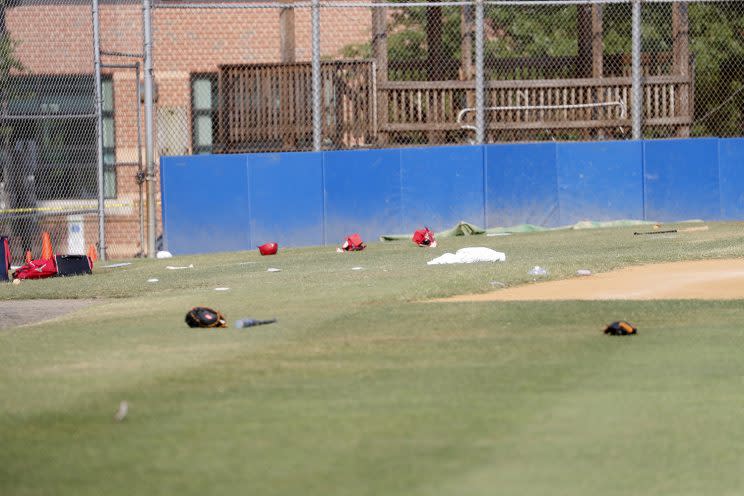 Baseball equipment is seen scattered on the field where a shooting took place at the practice of the Republican congressional baseball team at Eugene Simpson Stadium Park in Alexandria, Va, June 14, 2017. (Shawn Thew/EPA)