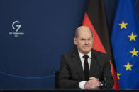 German Chancellor Olaf Scholz sits in front of a camera prior to his speech for the Davos Agenda 2022, at the chancellery in Berlin, Germany, Wednesday, Jan. 19, 2022. The Davos Agenda, which takes place from Jan. 17 to Jan. 21, 2022, is an online edition of the annual Davos meeting of the World Economy Forum due to the coronavirus pandemic. (AP Photo/Markus Schreiber, Pool)