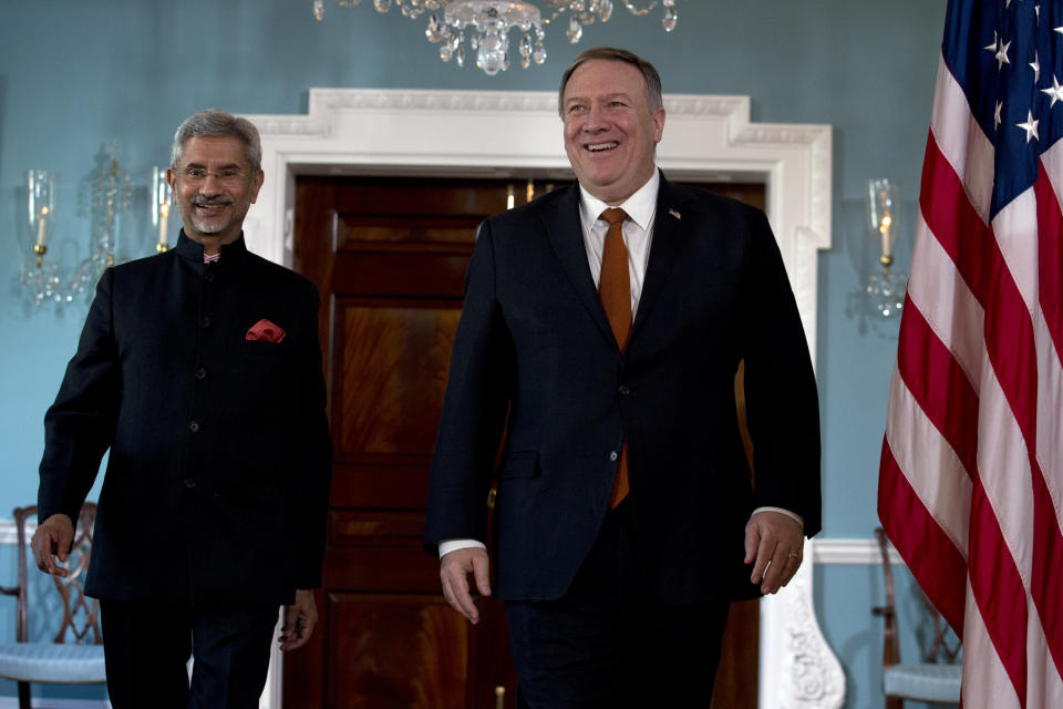Secretary of State Mike Pompeo accompanied by Indian External Affairs Minister Dr. S. Jaishankar walk to meet the media before a bilateral meeting at the Department of State in Washington, Wednesday, Dec.18, 2019. (AP Photo/Jose Luis Magana)