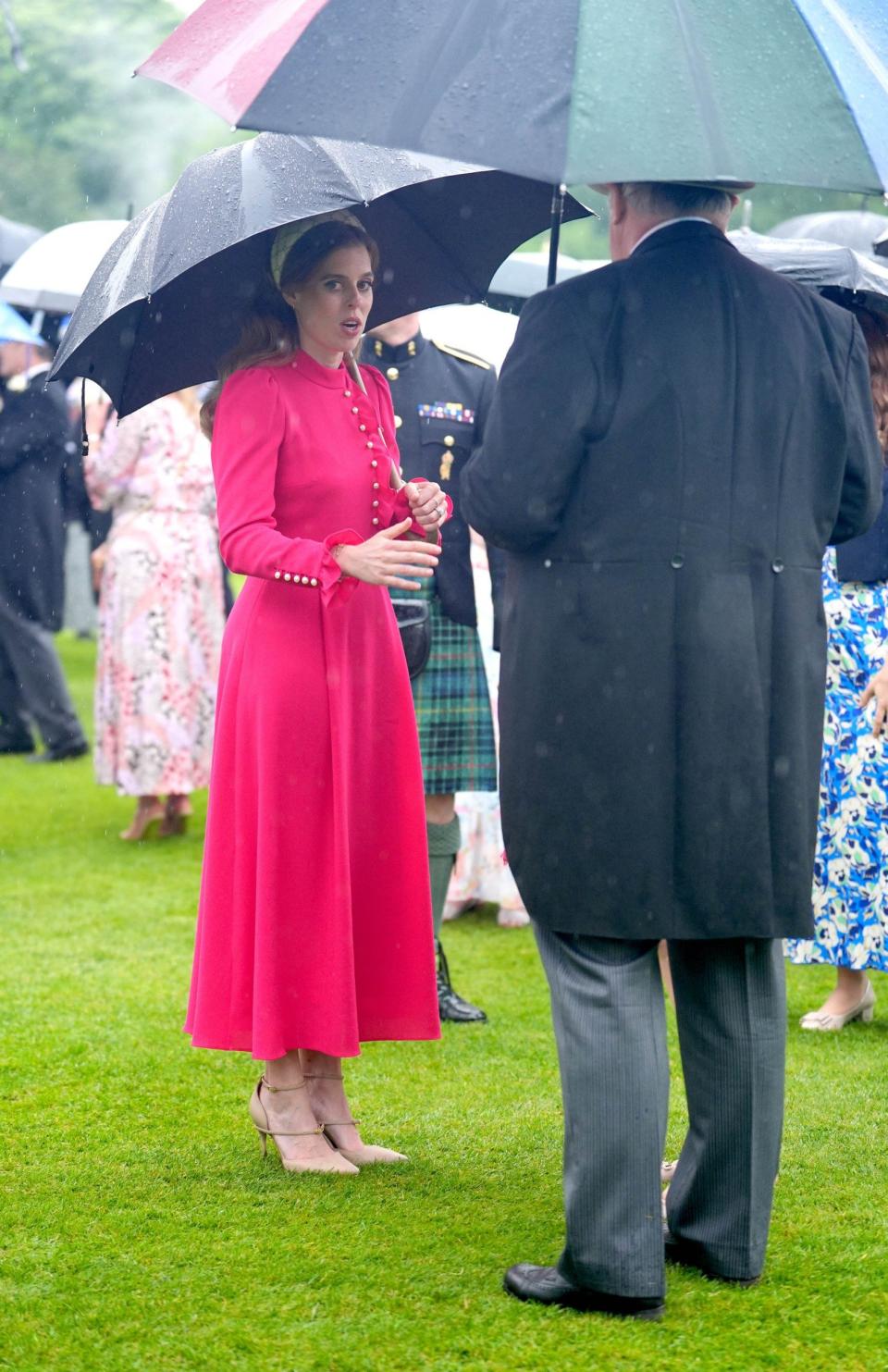 Princess Beatrice wore high heels to greet guests at the party