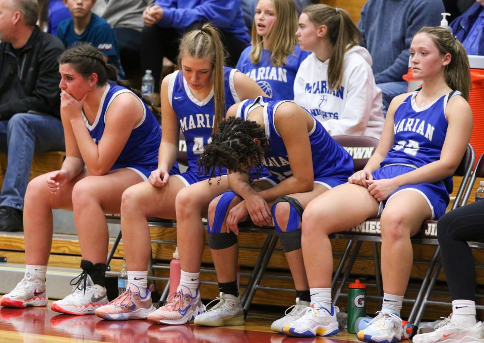 The Mishawaka Marian bench reacts late in the 4th quarter  of the IHSAA Regional Finals Saturday, Feb. 11, 2023 at Jimtown High School.