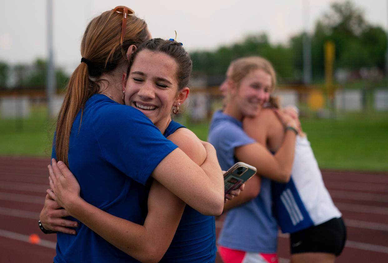 Castle’s Isabel Land celebrates her win in the 1600 meter run during the 2024 Southern Indiana Athletic Conference Girls Track & Field meet at Central High School in Evansville, Ind., Wednesday, May 1, 2024.