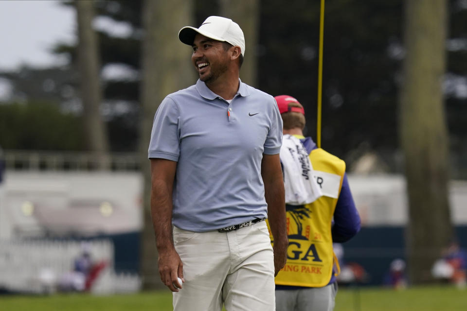Jason Day of Australia, smiles has he walks off on the ninth green during the first round of the PGA Championship golf tournament at TPC Harding Park Thursday, Aug. 6, 2020, in San Francisco. (AP Photo/Jeff Chiu)