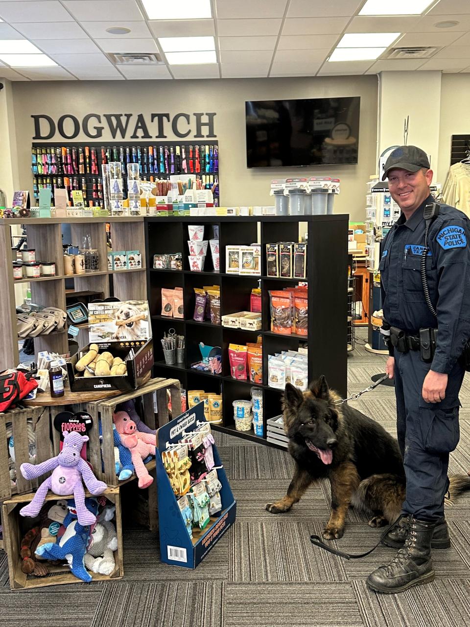 Michigan State Police trooper Jeff Schrieber of the Brighton post and his K-9 Woodson got a medical kit for dogs donated by DogWatch in Brighton Thursday, April 4, 2024.