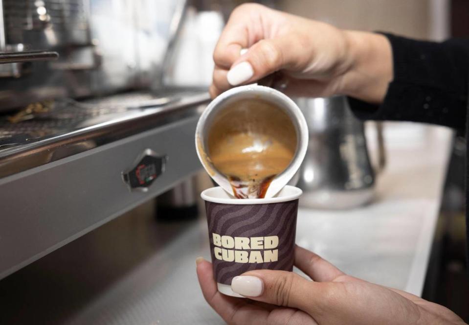 A barista pours a cordadito into a to-go cup during the Bored Cuban restaurant soft opening. The restaurant sells many to-go items, including croquetas, empanadas, acai bowls, wraps and a wonderful Cuban pop tart with guava and cream cheese.