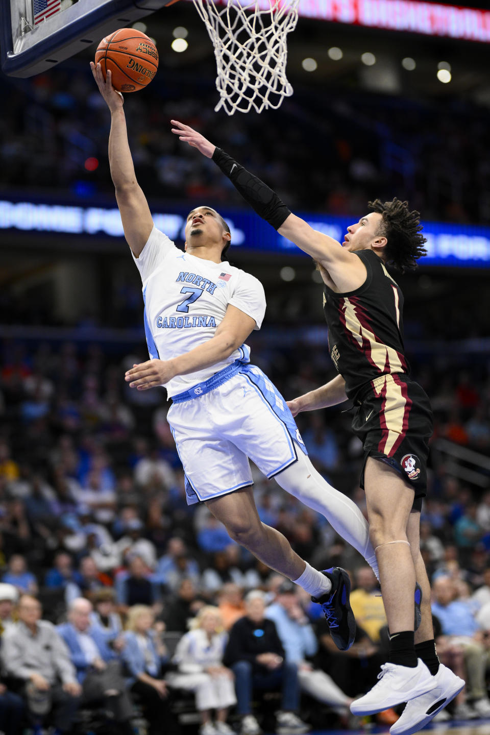 North Carolina guard Seth Trimble shoots in front of North Carolina forward Zayden High during the second half of an NCAA college basketball game in the quarterfinal round of the Atlantic Coast Conference tournament, Thursday, March 14, 2024, in Washington. (AP Photo/Nick Wass)