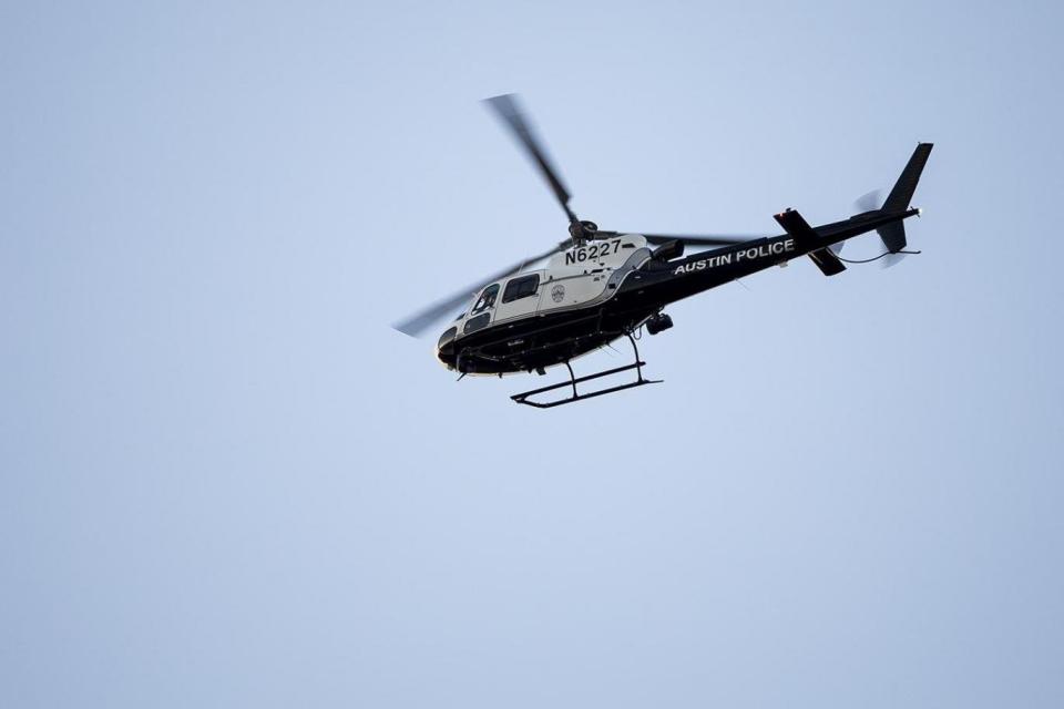 A police helicopter circles above Austin after the latest in a series of explosions (AP)