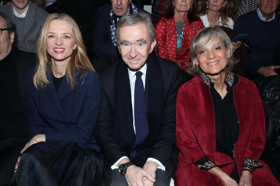 Louis Vuitton's executive vice president Delphine Arnault, Owner of LVMH Luxury Group Bernard Arnault and his wife Helene Arnault attend the Dior show as part of the Paris Fashion Week Womenswear Fall/Winter 2020/2021 on February 25, 2020 in Paris, France.
