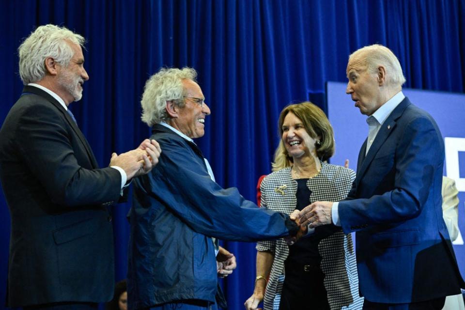 Biden shakes Joseph Kennedy II's hand after members of the famous family endorsed his presidential campaign.