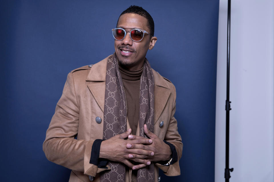 FILE - In this Dec. 10, 2018, photo, Nick Cannon poses for a portrait in New York to promote promoting his new show, "The Masked Singer." Cannon turns 40 on Oct. 8. (Photo by Amy Sussman/Invision/AP, File)