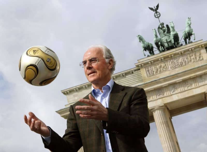 The then President of the 2006 World Cup Organizing Committee, Franz Beckenbauer, presents the golden soccer for the 2006 World Cup final in front of the Brandenburg Gate. Franz Beckenbauer, considered the greatest German football legend, died on Sunday at the age of 78, his family told  dpa on Monday. Peer Grimm/dpa