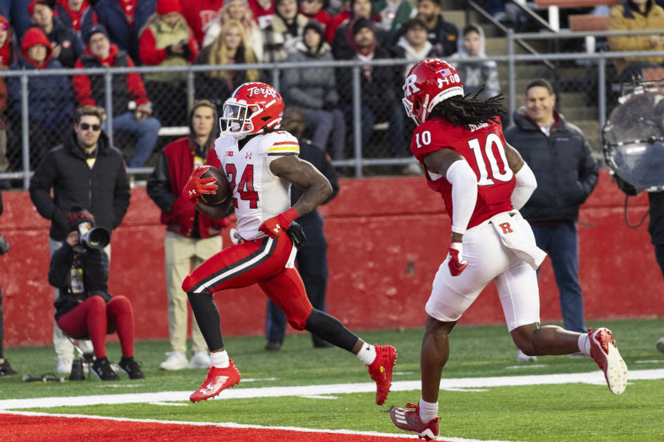 Maryland running back Roman Hemby (24) runs for a touchdown while chased by Rutgers defensive back Flip Dixon (10) in the first half of an NCAA college football game, Saturday, Nov. 25, 2023, in Piscataway, N.J. (AP Photo/Corey Sipkin)