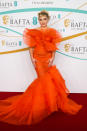 <p> This dress and hair combo literally brought the internet to its knees. Florence stepped out in this extravagant and elegant orange offering of ruffles and tulle&#x2014;going so far as to even match her micro fringe and hair to the structured frills of fabric.&#xA0; </p> <p> This dress showed off Florence&apos;s love of sheer outfits and was customized made for her and designed by Harris Reed, the Creative Director of Nina Ricci. </p>