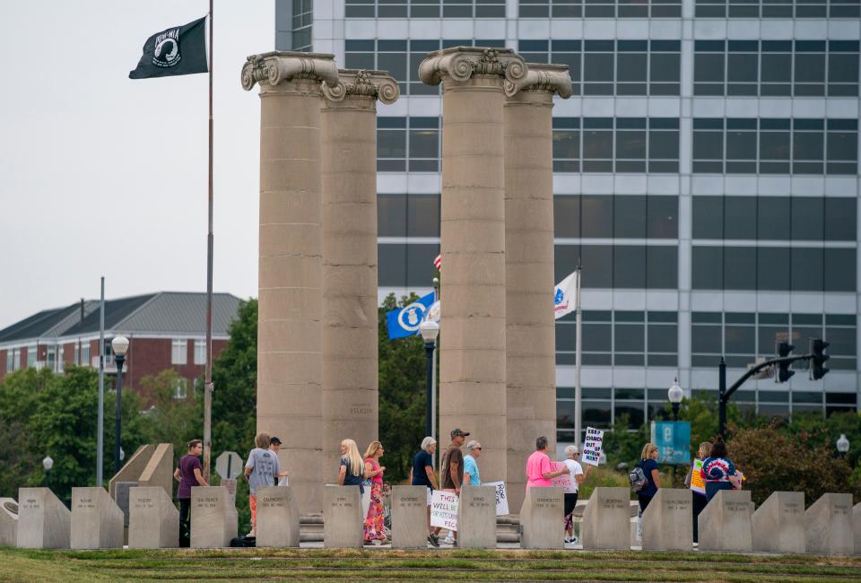 People gaher for during a rally for reproductive rights at the Four Freedoms Monument in Evansville, Ind., Thursday, Sept. 12, 2024.