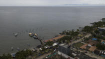 The pier where migrants leave in boats toward Capurgana to reach the Panamanian border, from Necocli, Colombia, Friday, July 30, 2021. (AP Photo/Ivan Valencia)