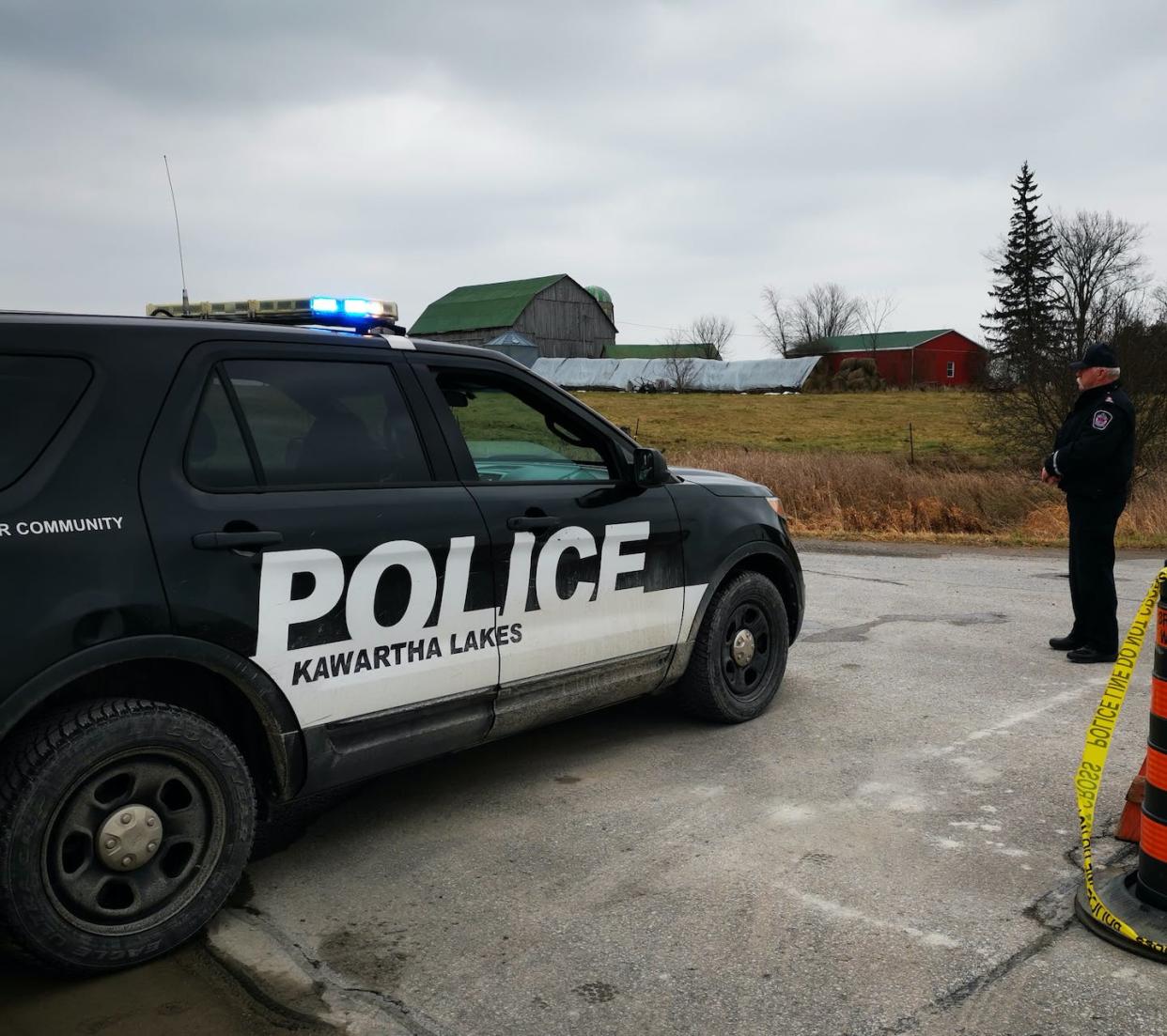 A special constable with the Kawartha Lakes Police Services stands at a road block in Kawartha Lakes, Ont. in November 2020, following the death of an 18-month-old boy during a police pursuit. THE CANADIAN PRESS/Doug Ives