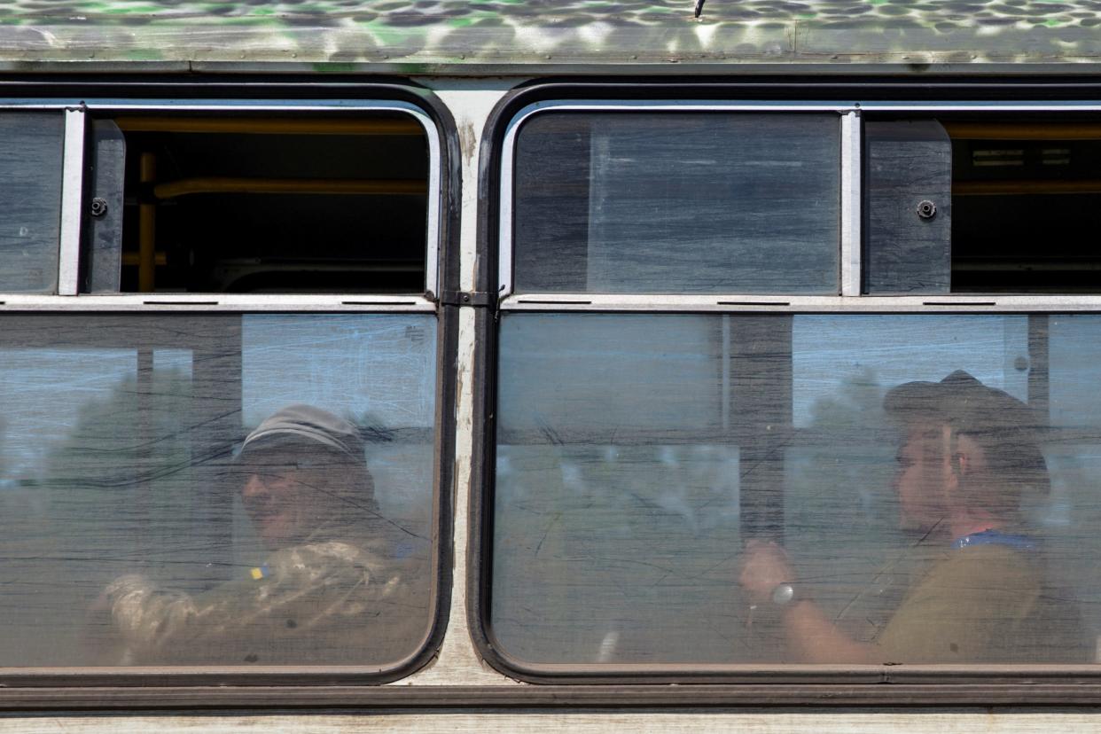 Ukrainian service members are seen inside a bus at a training ground near a frontline, amid Russia's attack on Ukraine, in Donetsk region (REUTERS)