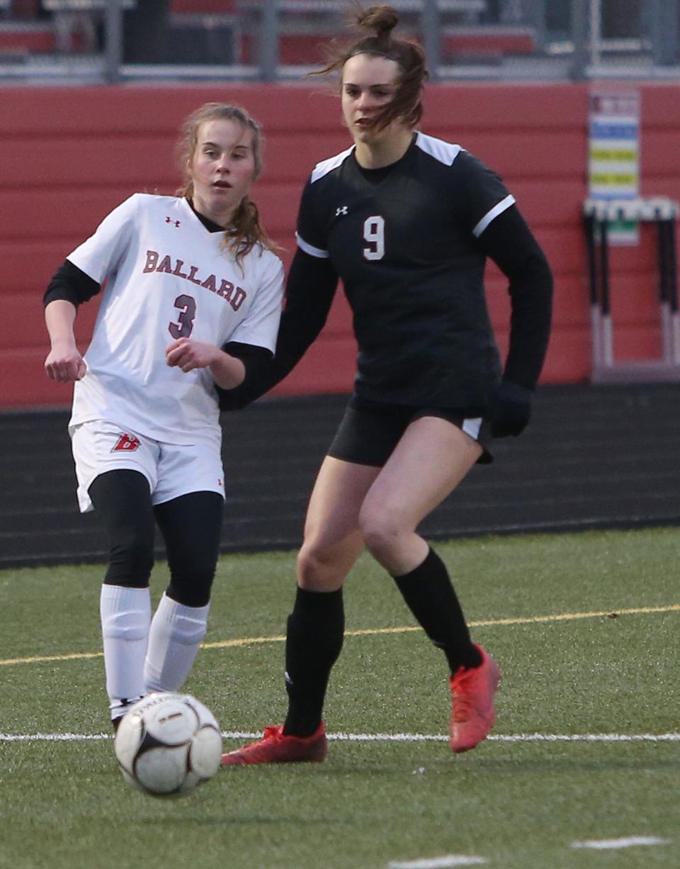 Ballard's Katie Tollefson (3) fights Gilbert's Alex Harswick for possessionof the ball during the first half of the Bombers' 8-0 loss to the Class 1A No. 5 Tigers April 3 at Gilbert.