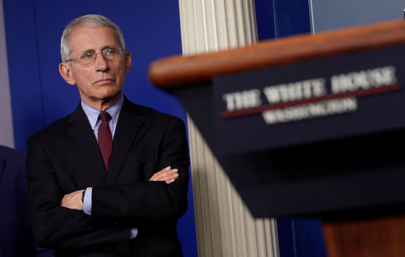 Dr. Anthony Fauci listens during the daily coronavirus response briefing at the White House in Washington