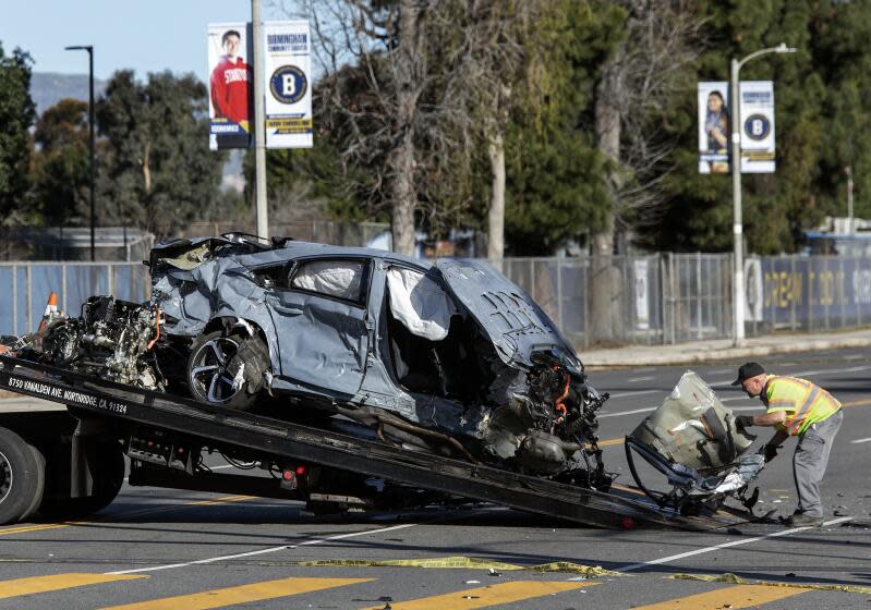 VAN NUYS, CA-FEBRUARY 8, 2023:The remains of a Honda Accord is loaded onto a flat bed truck at the intersection of Balboa Blvd. and Victory Blvd. in Van Nuys. According to LAPD Sgt. Hector Gutierrez, at approximately 3:45 am this morning, the driver of the Corvette, a male, was traveling an estimated 90 to 100 mph, heading north on Balboa Blvd. and crashed into a Honda Accord, driven by a woman in her forties, traveling east on Victory Blvd. Both drivers of the cars died as a result. It is believed that the driver of the Corvette went through a red light. The passenger in the Corvette, a male, was taken to a hospital with severe injuries. There were no passengers in the Honda Accord. (Mel Melcon / Los Angeles Times)