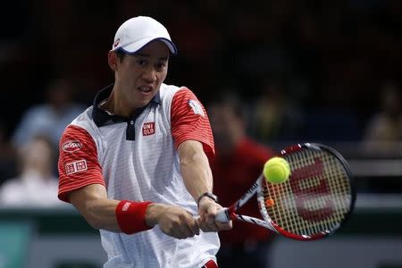 Kei Nishikori of Japan returns a shot during his men's singles tennis match against Jo-Wilfried Tsonga of France in the third round of the Paris Masters tennis tournament at the Bercy sports hall in Paris, October 30, 2014. REUTERS/Benoit Tessier