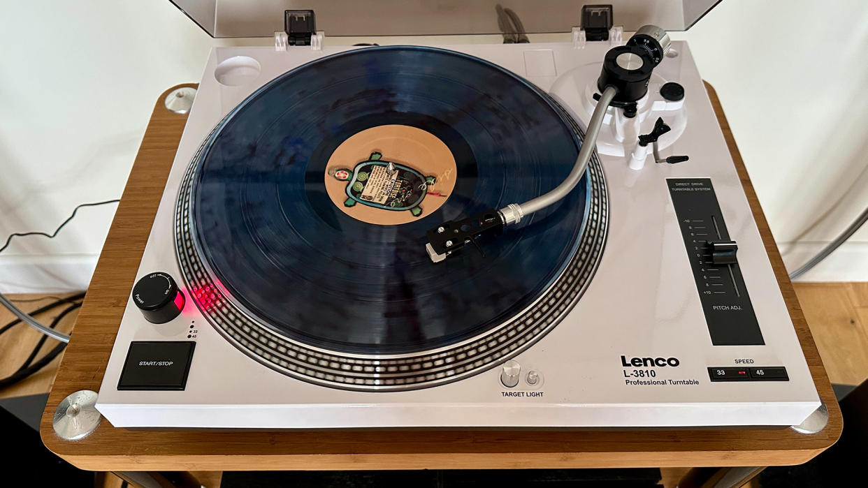  The Lenco L-3180 playing a record . 