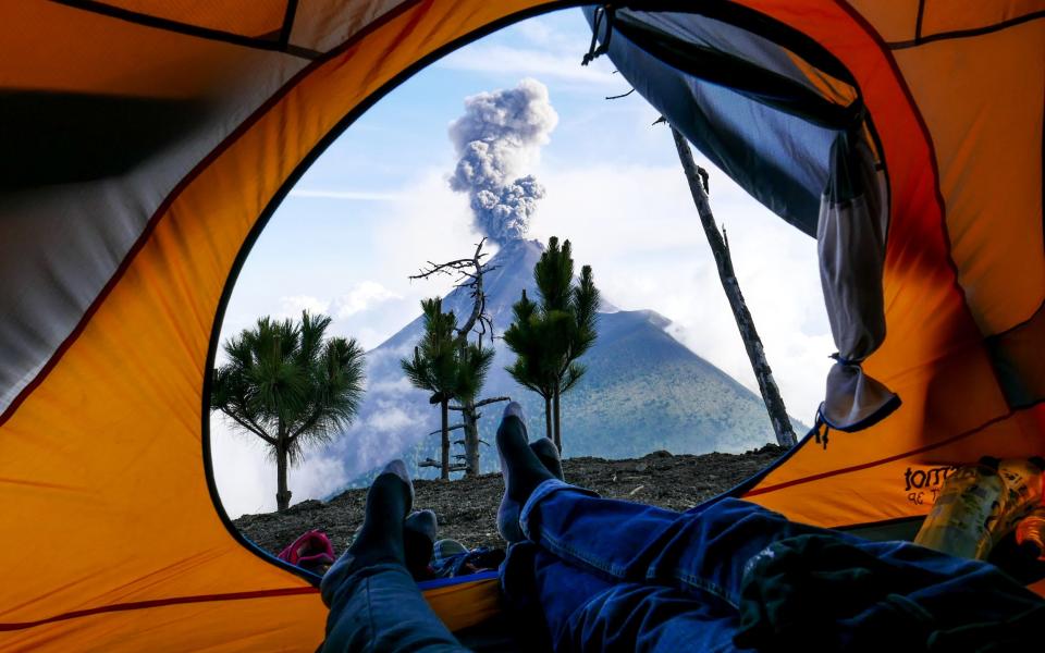 Bex Band and her husband in a tent on Hiking Acatenango in Gutemala - Bex Band