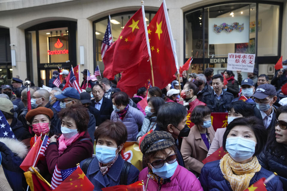 Protesters opposed to Taiwanese independence gather at a hotel where Taiwanese President Tsai Ing-wen is expected to arrive in New York, Wednesday, March 29, 2023. (AP Photo/Seth Wenig)