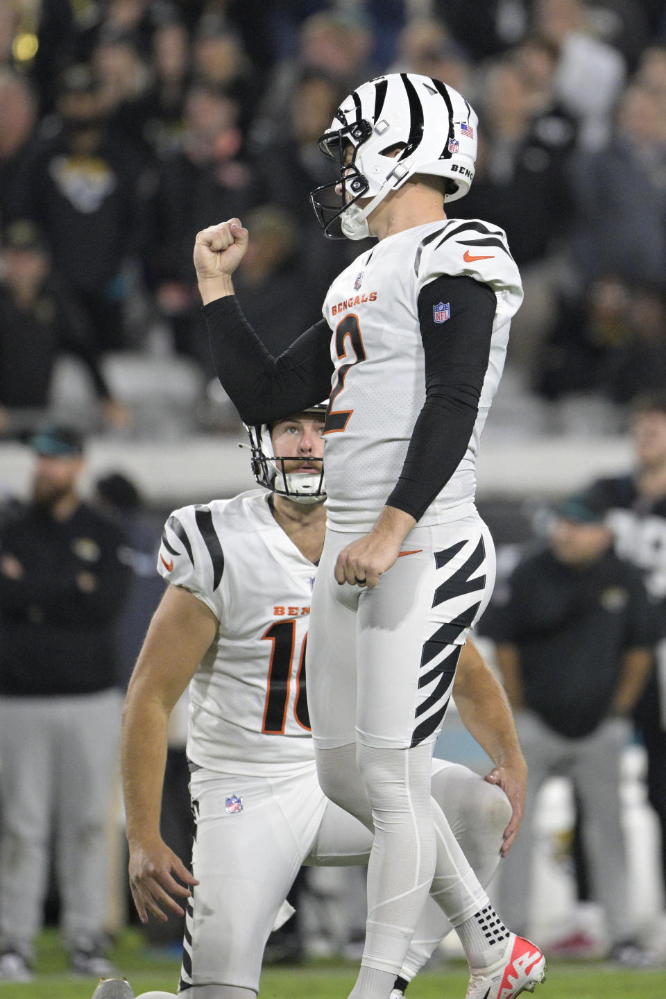 Cincinnati Bengals place-kicker Evan McPherson (2) celebrates after kicking a field goal in overtime at an NFL football game against the Jacksonville Jaguars, Monday, Dec. 4, 2023, in Jacksonville, Fla. The Bengals defeated the Jaguars 34-31. (AP Photo/Phelan M. Ebenhack)