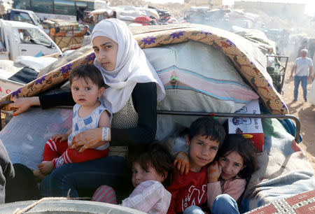 FILE PHOTO: Syrian refugees prepare to return to Syria from the Lebanese border town of Arsal, Lebanon June 28, 2018. REUTERS/Mohamed Azakir/File Photo