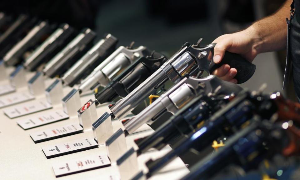 In this file photo, handguns are displayed at the Smith & Wesson booth at the Shooting, Hunting and Outdoor Trade Show in Las Vegas.