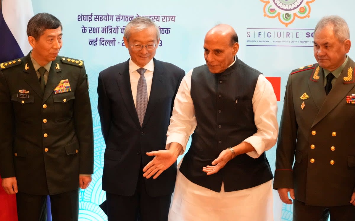 Indian defence minister Rajnath Singh (second from right) talks with his Russian counterparts Sergei Shoigu (right), Chinese General Li Shangfu (left) and the Shanghai Cooperation Organization’s secretary-general Zhang Ming (AP)